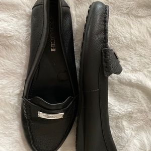 Chic black leather Coach loafers